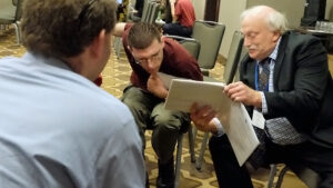 Alan Kurtz talking with self-advocates at AUCD conference.