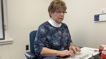 Bonnie Robinson working at her computer.