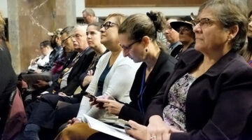 Audience listenting to closing plenary session at AUCD 2019 conference.